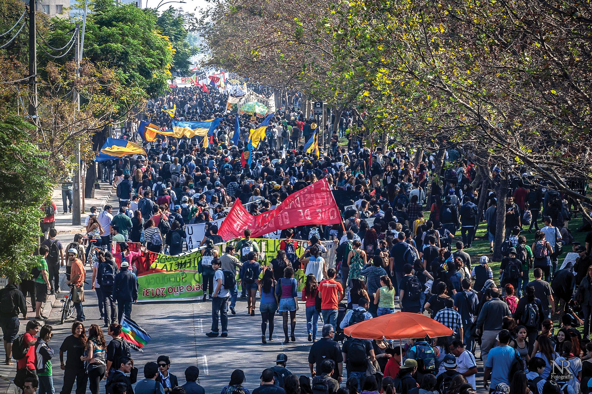 The Chilean student movement still generates energy, with a large crowd of protestors moving down a street inMay 2013. (Photo by Nicolás Robles Fritz.)