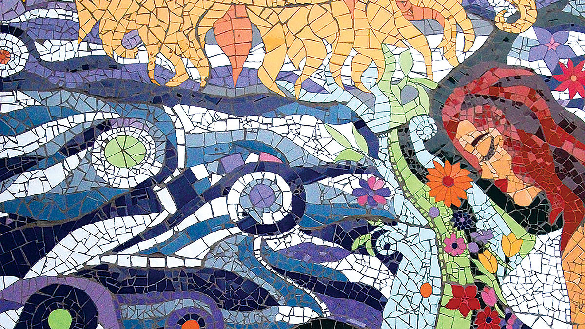Detail of colorful tile mosaic of a pregnant woman with the sun, sea, and clouds, Santiago, Chile. (Photo by Carolina Macaya.) Detail of colorful tile mosaic of a pregnant woman with the sun, sea, and clouds, Santiago, Chile. (Photo by Carolina Macaya.)