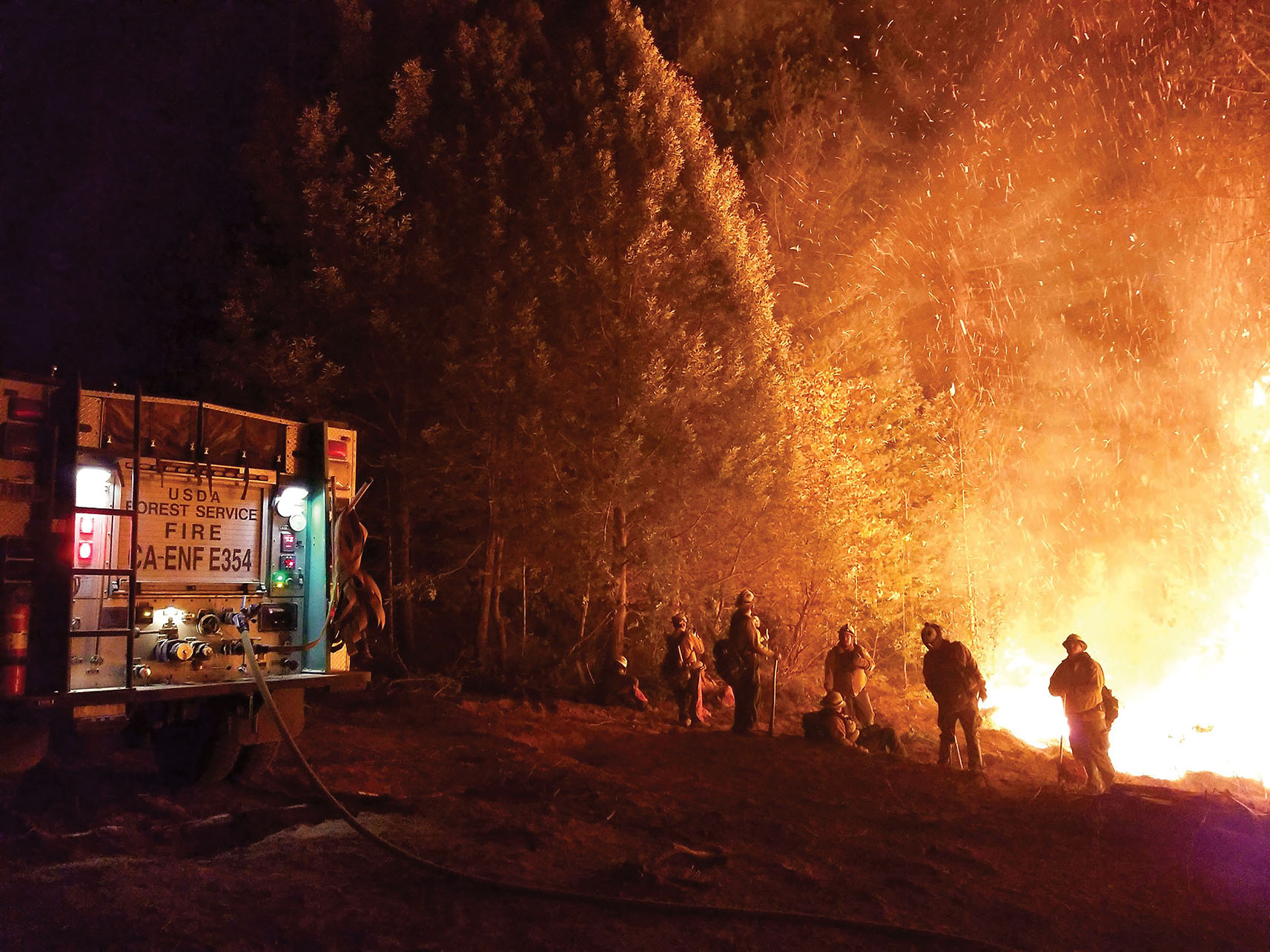 A photo of firefighters battling the Camp Fire in northern California, 2018. (Photo courtesy of Pacific Southwest Region 5, U.S. Forest Service.)