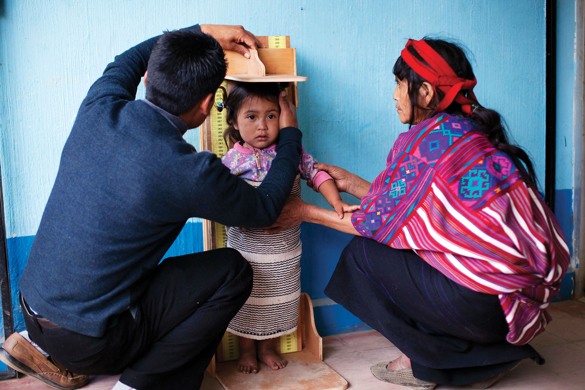 A three-year-old Guatemalan girl's height and weight are measured as part of a nationwide campaign against malnutrition known as “Zero Hunger.” (Photo by Rodrigo Abd/Associated Press.)
