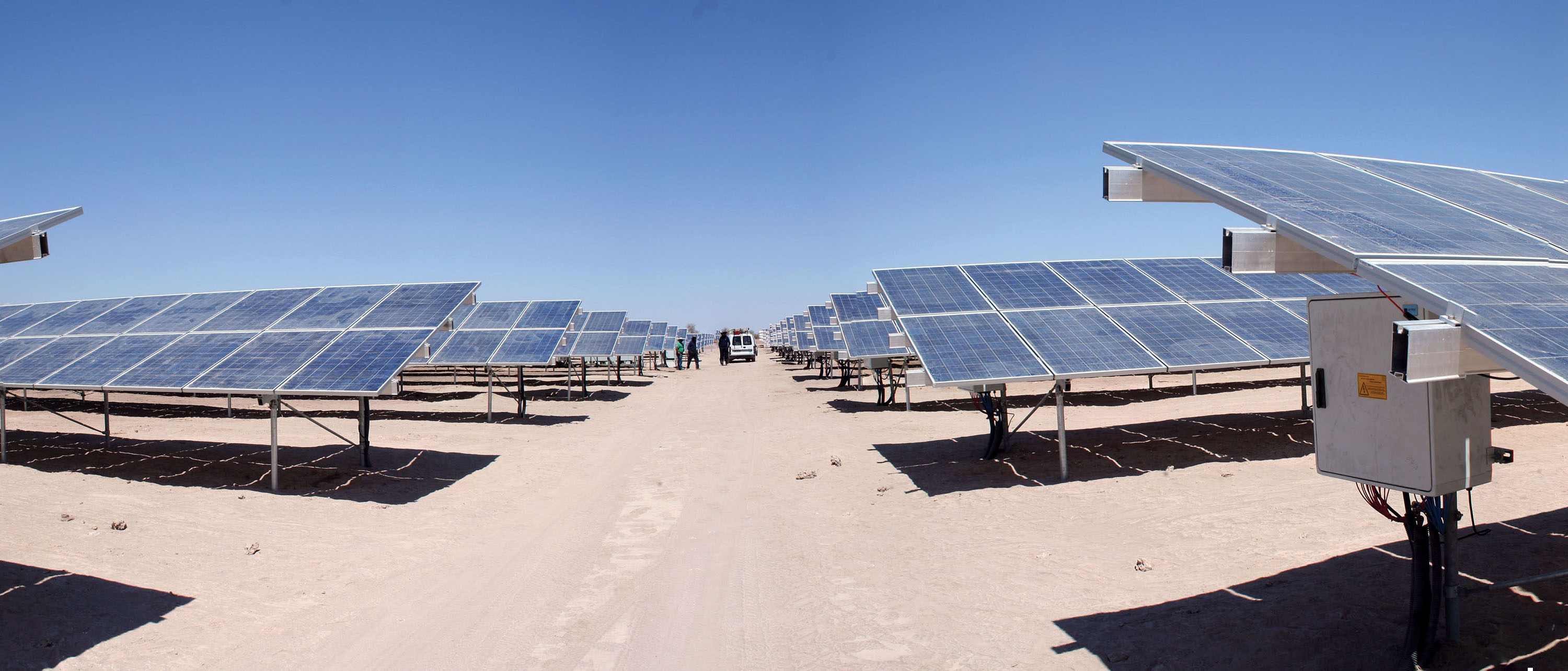 Looking down a dirt road through a massive photovoltaic array in the Atacama Desert, Chile. (Photo by Rodrigo Arancibia Zamora.)