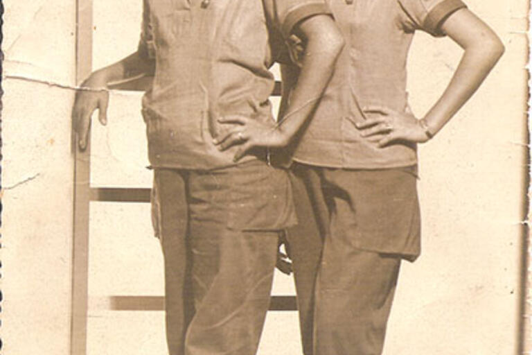 Sepia photography of two cuban woman wearing a teacher uniform