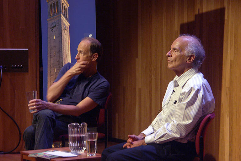 Charles Ferguson taking questions from the audience, seating next to Harley Shaiken 