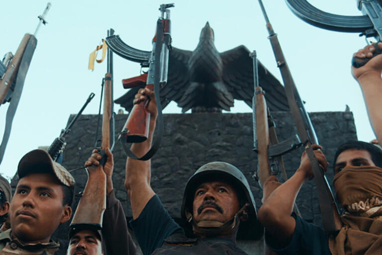 A group of men holding guns