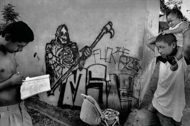 Image from cover of "Violence at the Urban Margin." White and black photo. 