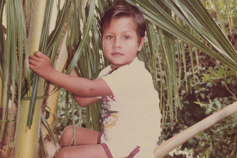 (Image courtesy of the Kennedy/Marshall Company.) Photo of Oscar climbing a tree