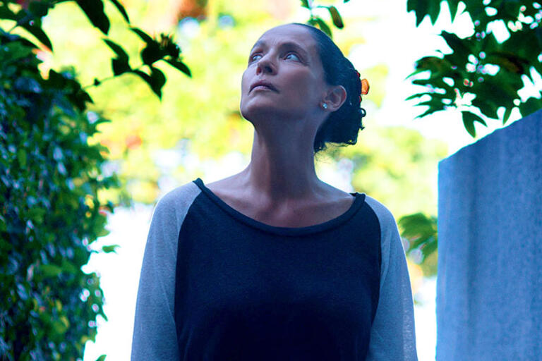 Actress Sonia Braga looking up the sky 