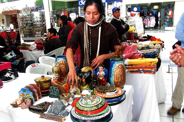 A fair to promote local products, necklaces being displayed