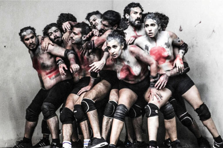 Artistic photography of a group of people covered in white paint 