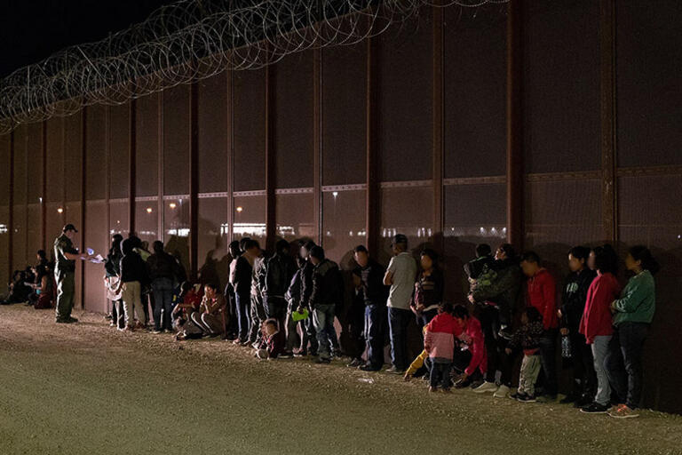 A group of migrants detained by the U.S. Border Patrol near Yuma, Arizona