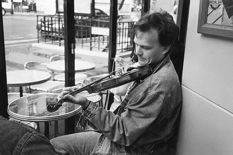 The Underground Orchestra film still A man playing the violin, black and white photo