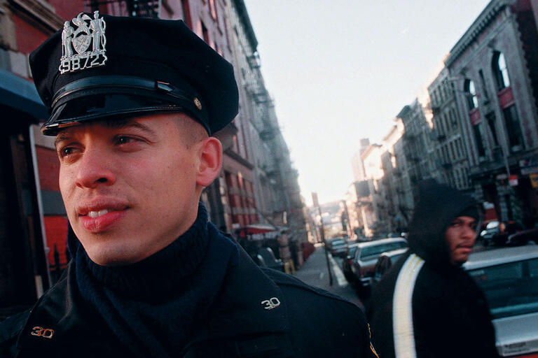A uniformed officer patrols New York’s Washington Heights neighborhood, 1998. (Photo by Mark Lennihan, Associated Press.) A uniformed officer patrols New York’s Washington Heights neighborhood, 1998. (Photo by Mark Lennihan, Associated Press.)
