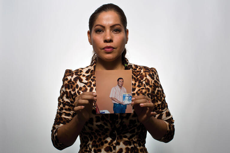 A woman holds a photo of her husband, one of “Los Otros de Iguala,” the other disappeared whose cases have gained new attention. (Photo by Dario Lopez-Mills/AP Photo.)
