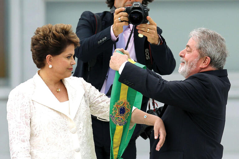Lula hands over the presidential sash to Dilma Rousseff for her inauguration in 2011. (Photo by Celso Junior/Agência Estado/AE.)