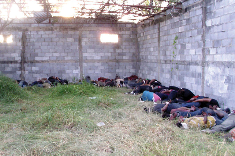 The bodies of 72 migrants allegedly killed by the Zetas drug gang were found in August 2010 in San Fernando, Tamaulipas. (Photo from the Associated Press/El Universal.)