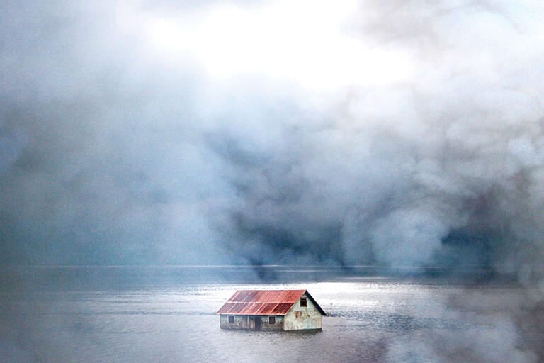 A house on Chiloé. (Photo by Carles Cerulla.) A house on Chiloé sits out in the water and fog. (Photo by Carles Cerulla.)