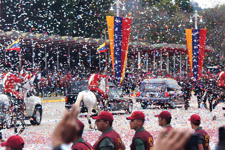 Hugo Chávez's funeral procession, with the hearse escorted by horse guards under a deluge of confetti. (Photo by Luigino Bracci.)