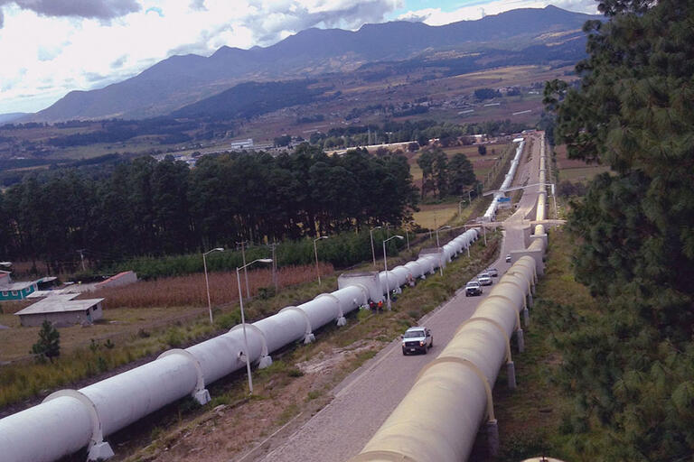 Massive pipes wait by a road to be installed in the Cutzamala System, supplying water to Mexico City. (Photo by sondemar007.)