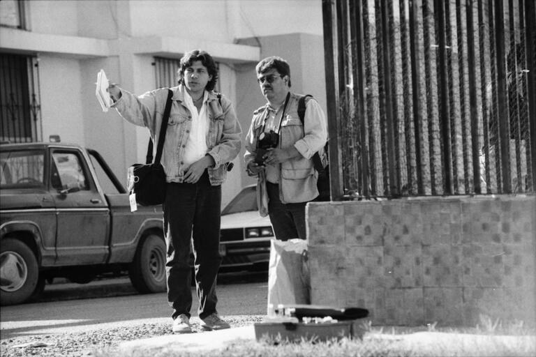 Zeta reporter Sergio Haro and a photographer working in the streets of Tijuana. (Photo courtesy of Quiet Pictures.)