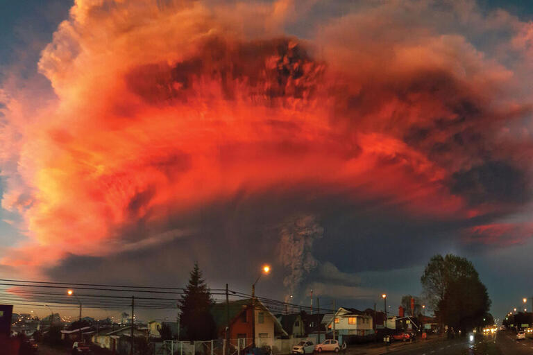 The sun colors the clouds of ash from Calbuco Volcano’s eruption, seen from Puerto Montt, Chile, April 22, 2015.(Photo by M.E. Aguila.)