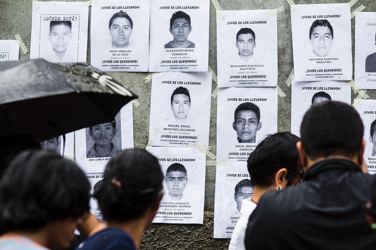 A display of missing Ayotzinapa students. (Photo by Jorge Mejia Peralta.) A display of photos and posters highlighting the missing Ayotzinapa students. (Photo by Jorge Mejia Peralta.)