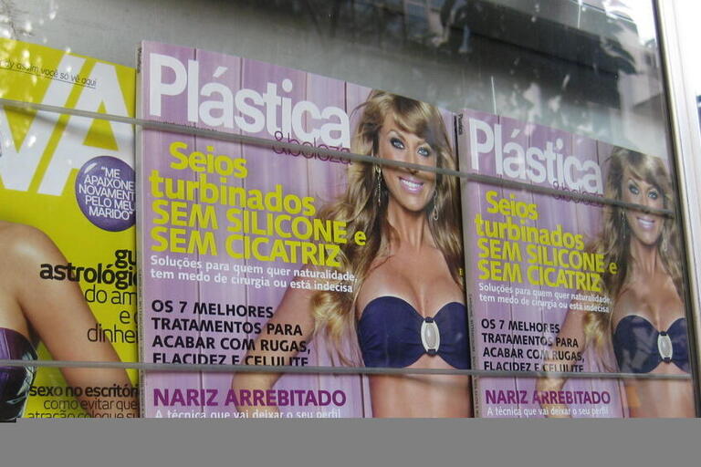 Magazine covers on the side of a building