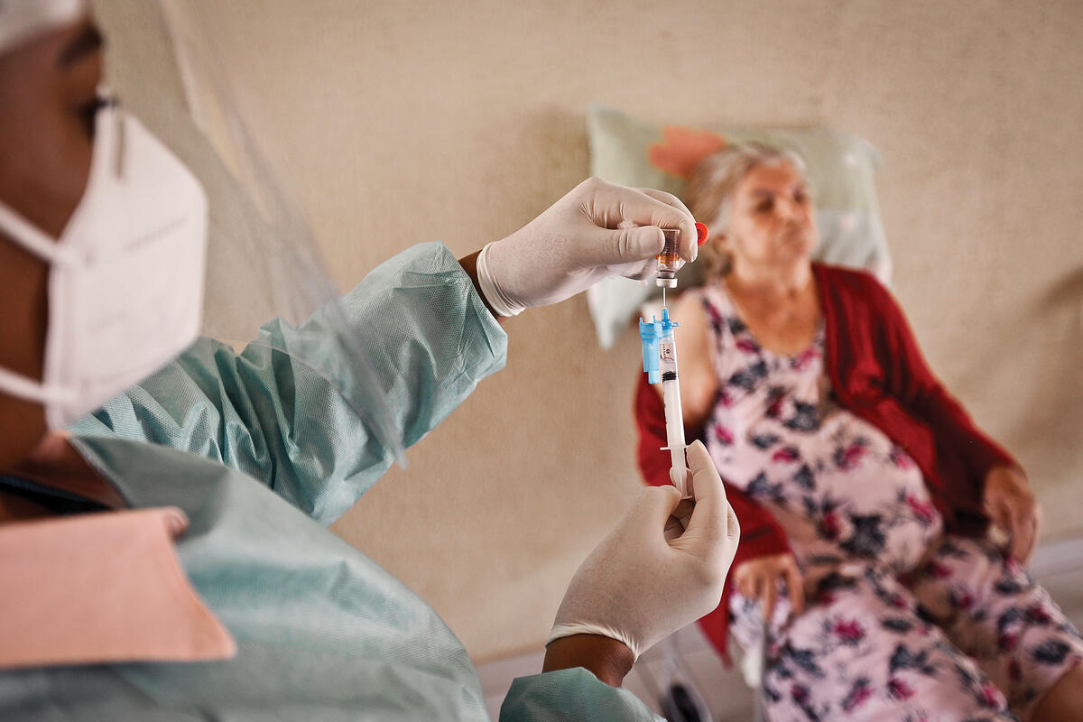 The cover image of the Spring 2021 Berkeley Review of Latin American Studies: A woman receives one of Brazil’s first Covid-19 vaccinations, February 2021. (Photo by Breno Esaki/Agência Saúde DF.) Brazil’s first Covid-19 vaccinations, February 2021. (Photo by Breno Esaki/Agência Saúde DF.)