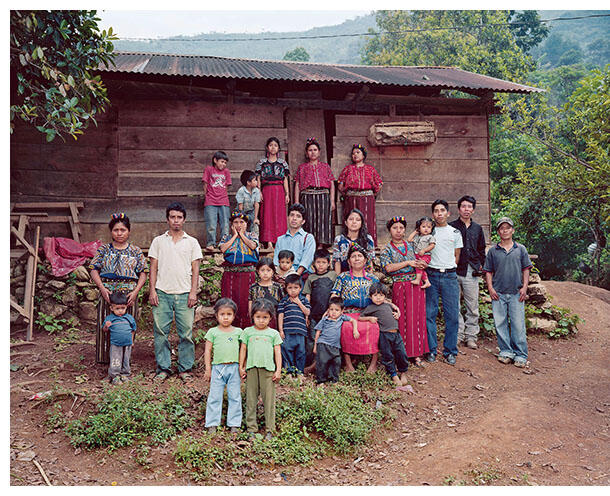 A Mayan family in front of their home in the Ixil highlands of Guatemala. (Photo by Dana Lixenberg.)
