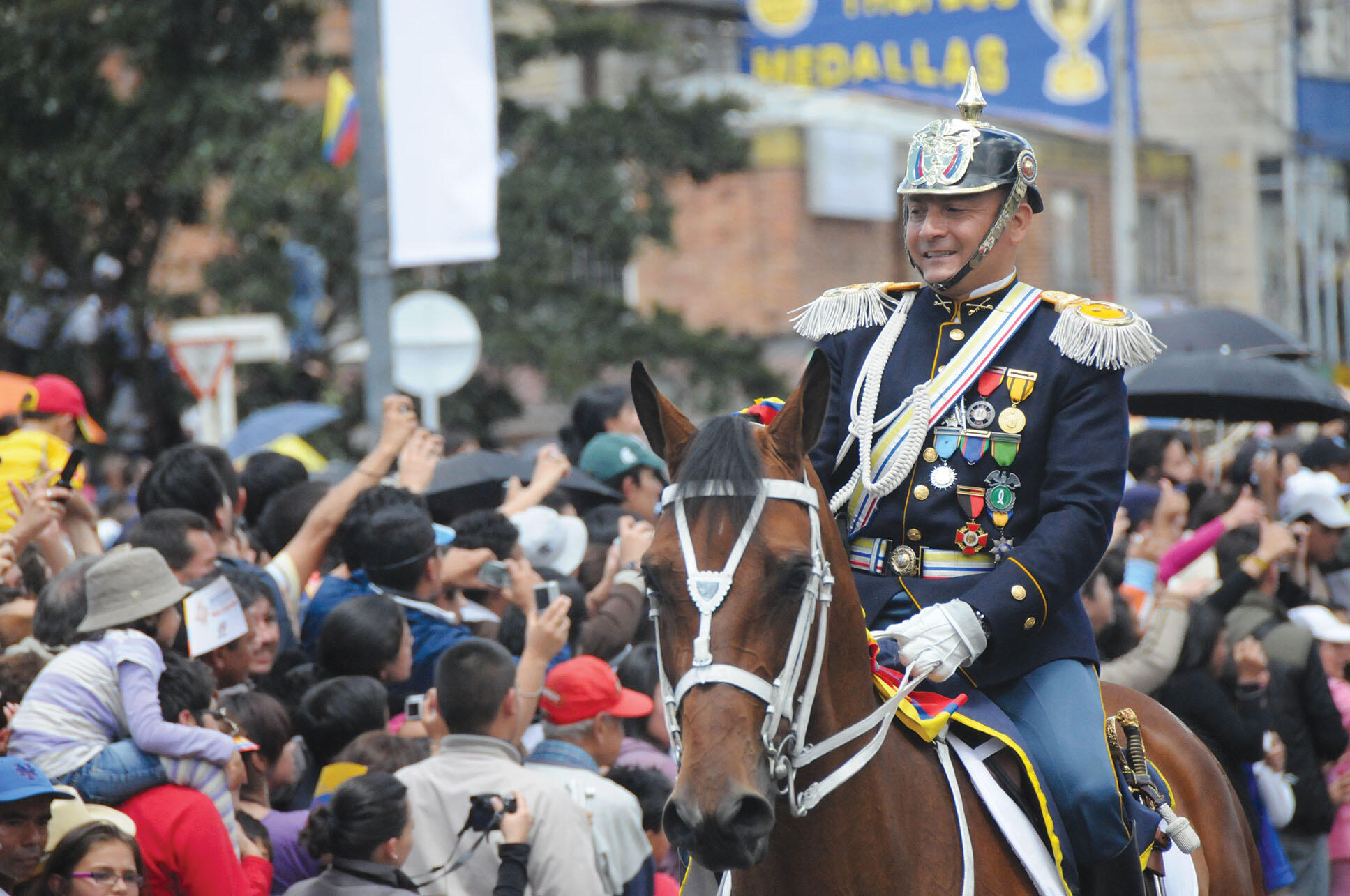 A man on horseback in an archaic uniform as the military parades in period uniforms during the Colombian bicentennial, 2010. (Photo by Ronald Dueñas.)