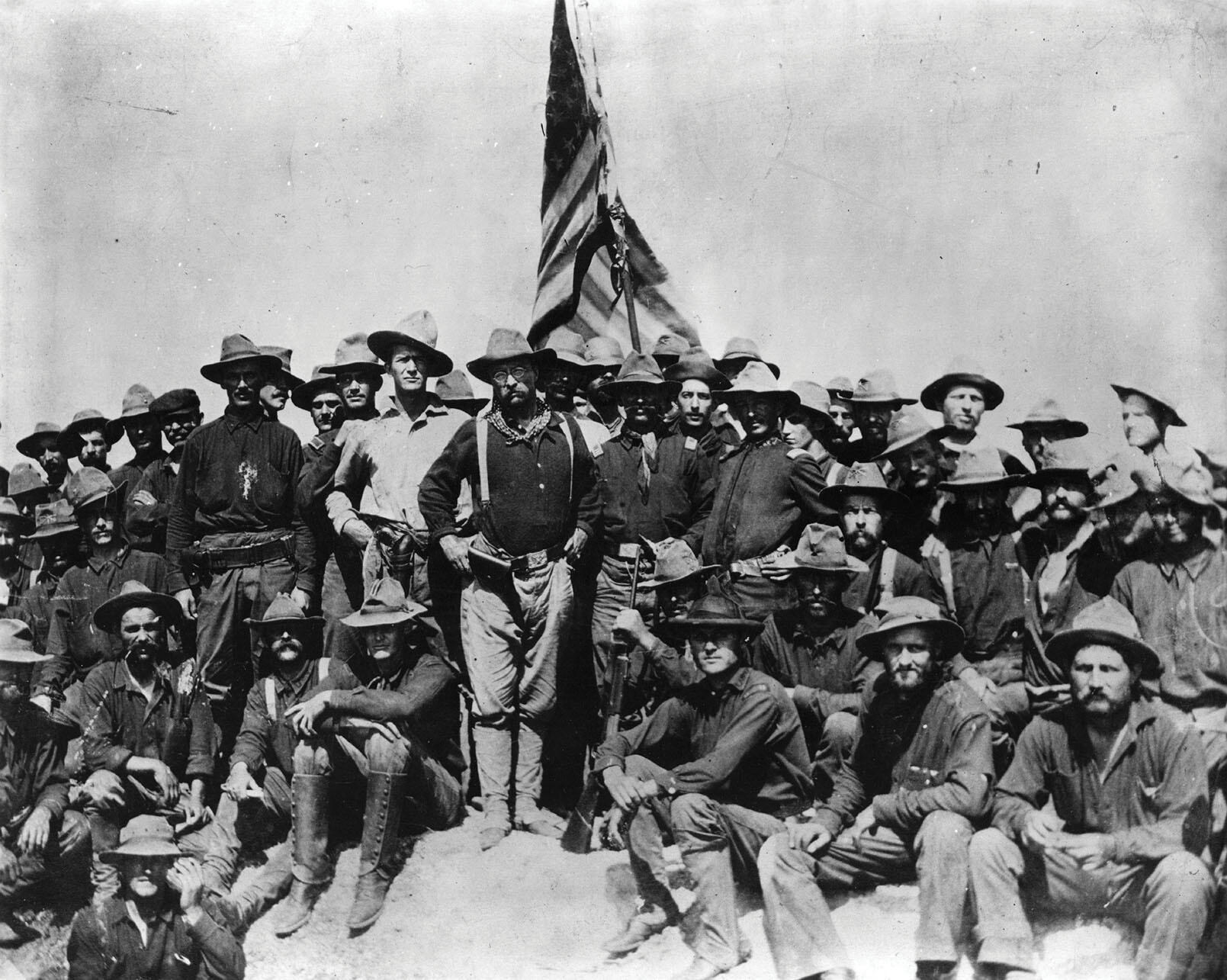 Theodore Roosevelt poses with other U.S. volunteers on San Juan Hill in 1898. (Photo by William Dinwiddie.)
