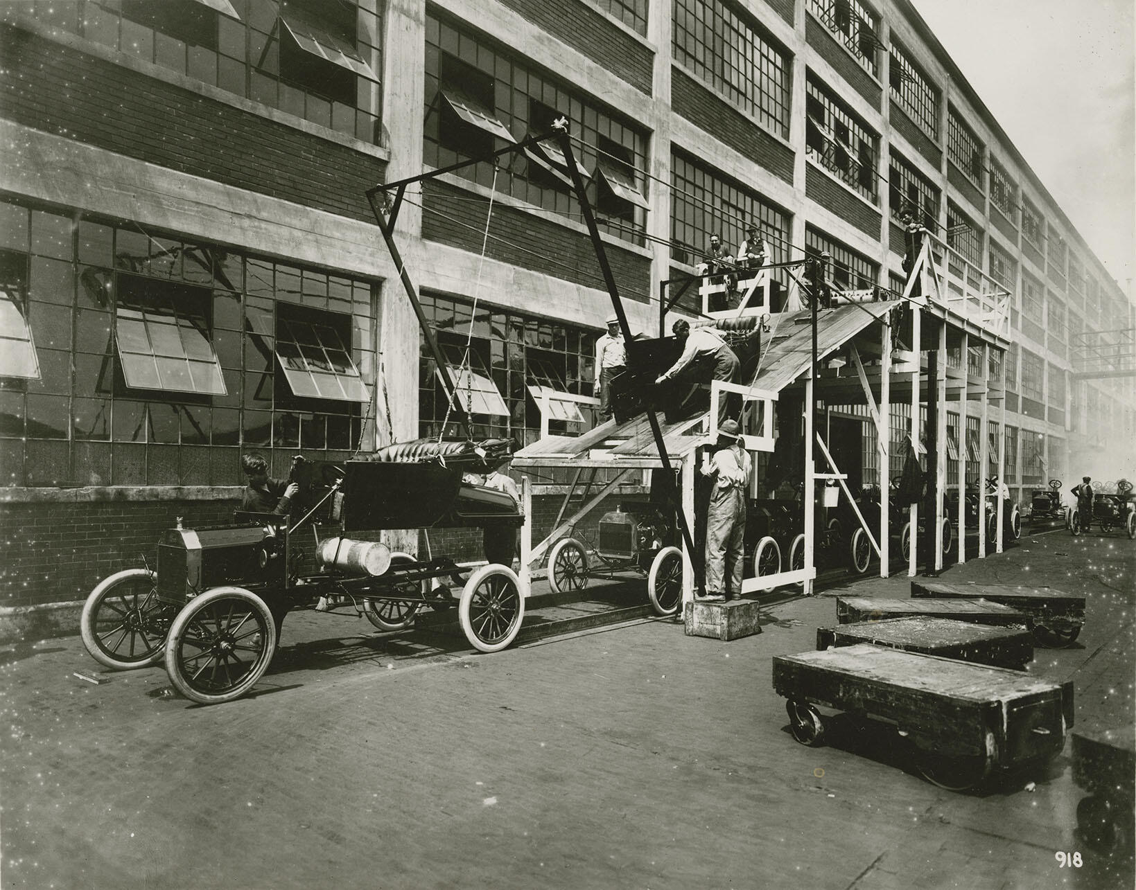 The Model T “body drop,” mating a body and chassis, circa 1914. (Photo from the Collections of  The Henry Ford Museum.)