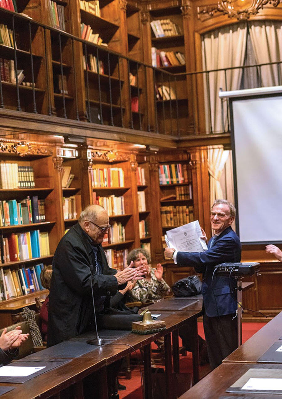Professor Randy Schekman receives an honorary degree from noted biochemist and biophysicist Jorge Allende at the Chilean Academy of Sciences. (Photo by Felipe Engelberger.)