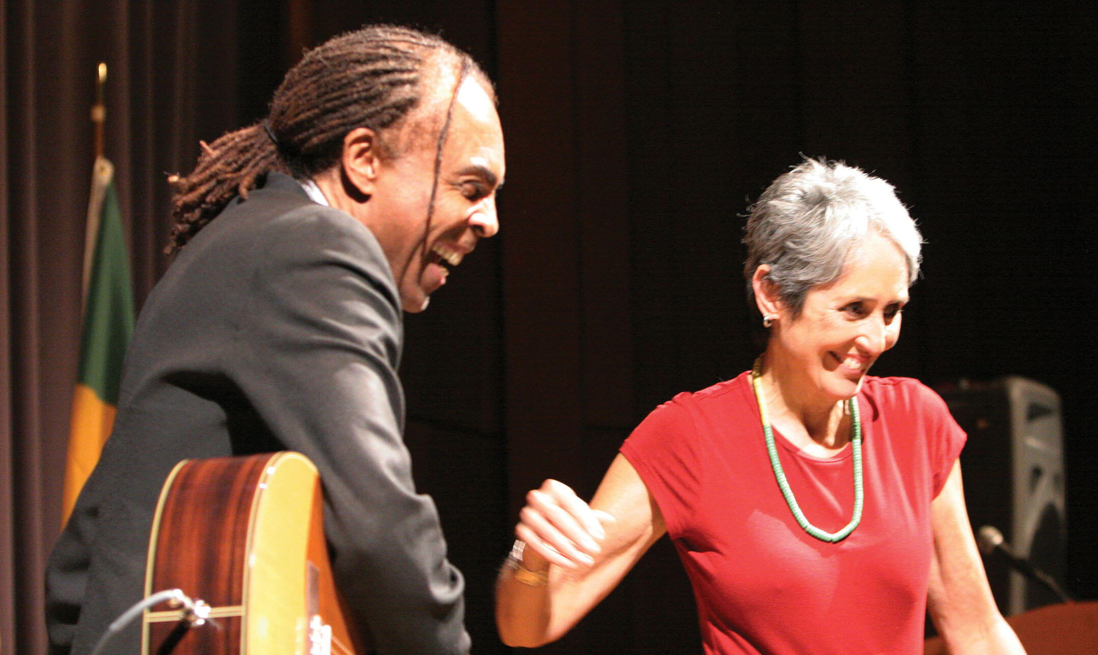 Gilberto Gil and Joan Baez while she dances during his performance at UC Berkeley, February 2005. (Photo by Scott Squire.)