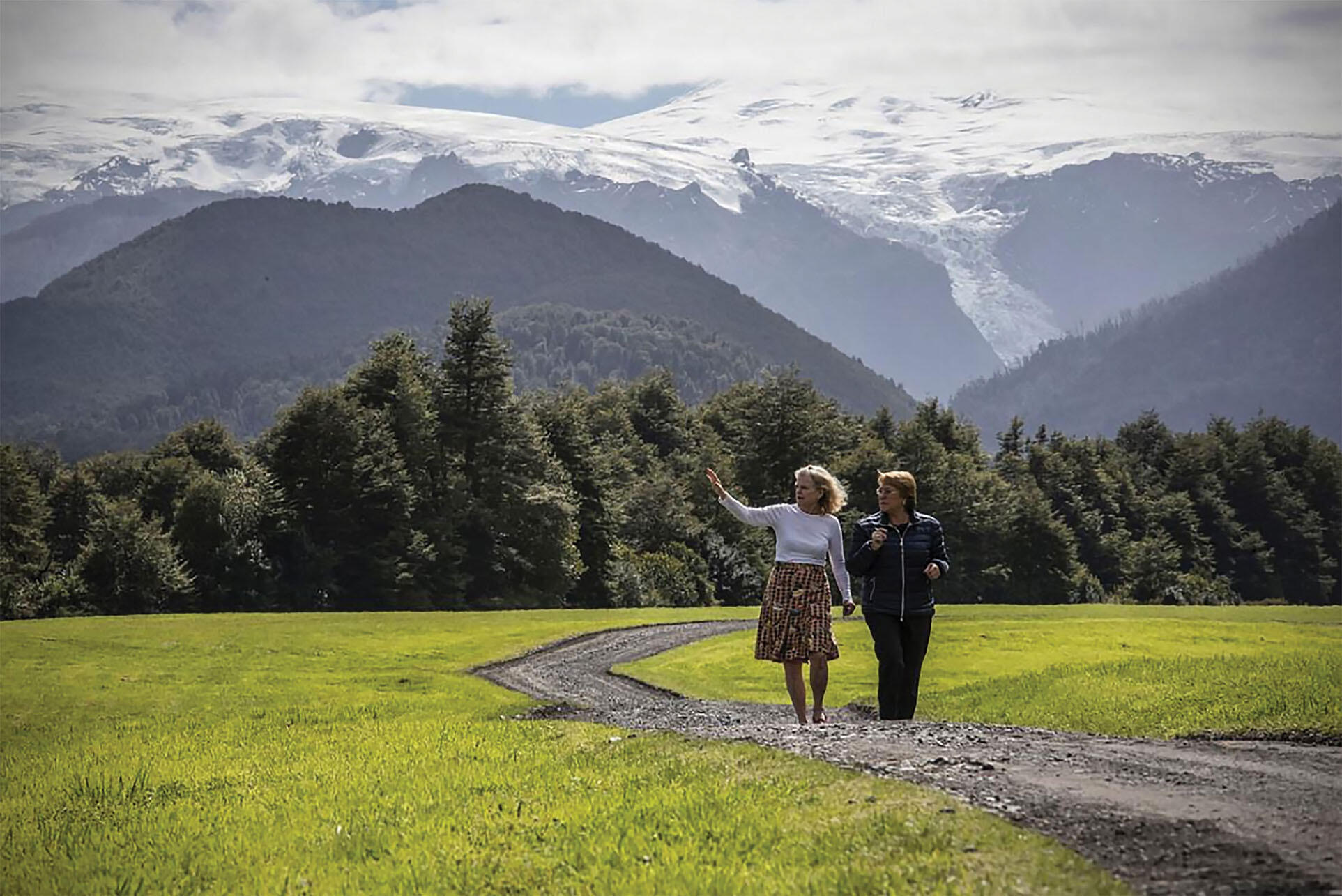 Michelle Bachelet walks with Kristine Tompkins through part of 10 million acres of new parkland donated by the Tompkins Foundation to Chile. (Photo courtesy of Gobierno de Chile.)
