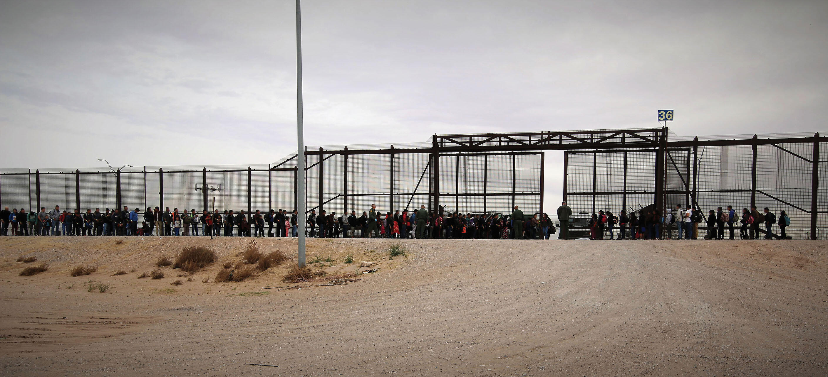 Border patrol agents process a group of migrants in El Paso, Texas, March 2019. (Photo by Jaime Rodriguez Sr./Customs and Border Patrol.)