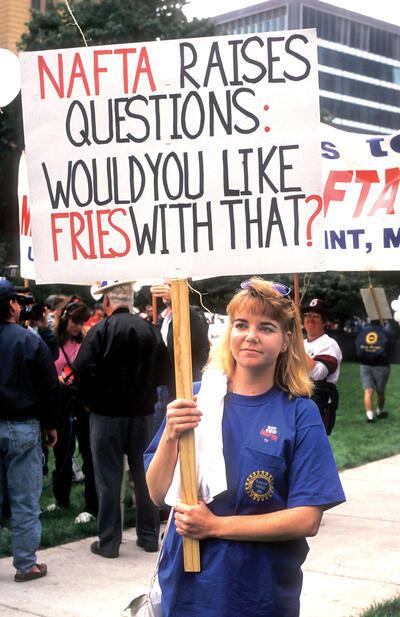 A protester questions the quality of jobs created under Nafta. (Photo by Jim West/Alamy Stock Photo.) A protester with a sign questioning the quality of jobs created under Nafta. (Photo by Jim West/Alamy Stock Photo.)