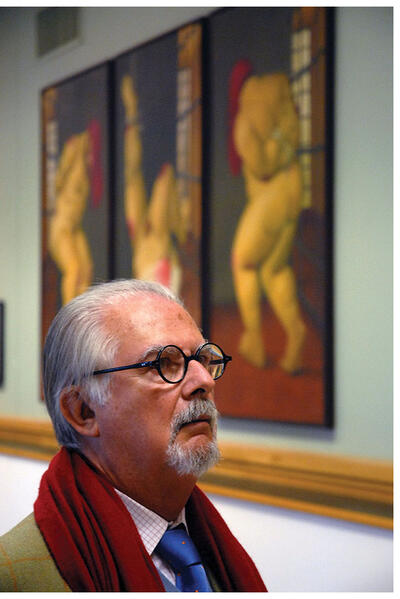 Fernando Botero looks at his works hanging on the walls in the Abu Ghraib exhibit at Berkeley, January 2007. (Photo by Jan Sturmann.)