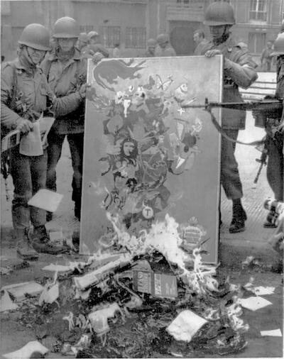 Chilean troops burn books and other banned items following the 1973 coup. (Photo from the U.S. Central Intelligence Agency, courtesy of Weekly Review.) Chilean troops burn books and other banned items following the 1973 coup. (Photo from the U.S. Central Intelligence Agency, courtesy of Weekly Review.)