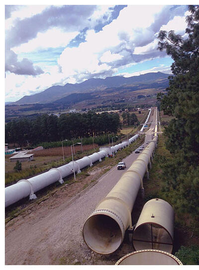 Massive pipes lie by the road waiting to be installed in the Cutzamala System, supplying water to Mexico City. (Photo by sondemar007.)