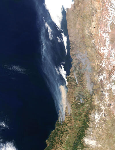 Smoke in this satellite photo of Chile shows the extent of the January 2017 wildfires. (Photo by Jeff Schmaltz/NASA.)